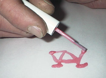 Joe sketching with nail polish